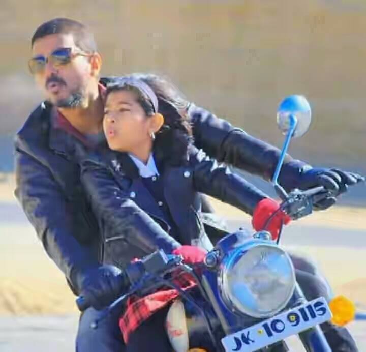 Vijay with his daughter